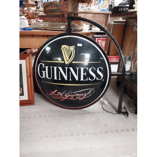 365 - Double sided Guinness light up advertising sign with bracket {62 cm H x 97 cm W}.