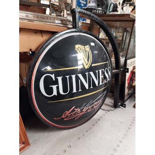 365 - Double sided Guinness light up advertising sign with bracket {62 cm H x 97 cm W}.