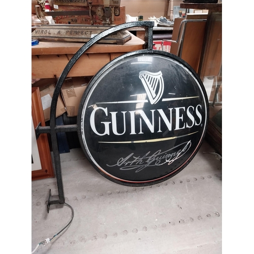 365 - Double sided Guinness light up advertising sign with bracket {62 cm H x 97 cm W}.