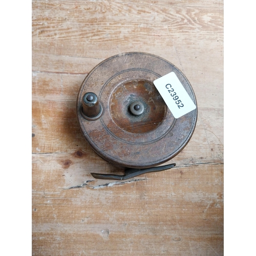 373 - Three 19th C. mahogany and brass fishing reels. {4 cm H x 13 cm Dia to 5 cm H x 5 cm Dia}.