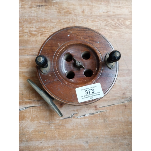 373 - Three 19th C. mahogany and brass fishing reels. {4 cm H x 13 cm Dia to 5 cm H x 5 cm Dia}.