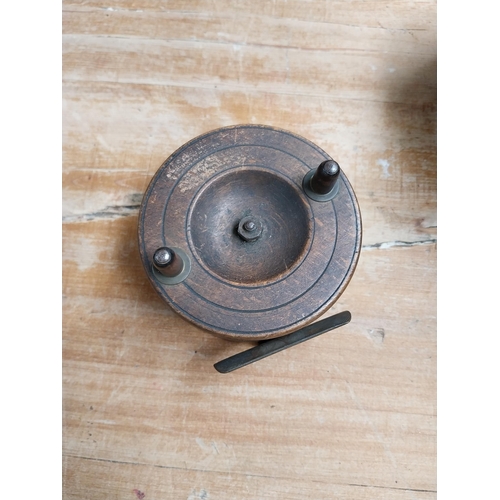 373 - Three 19th C. mahogany and brass fishing reels. {4 cm H x 13 cm Dia to 5 cm H x 5 cm Dia}.