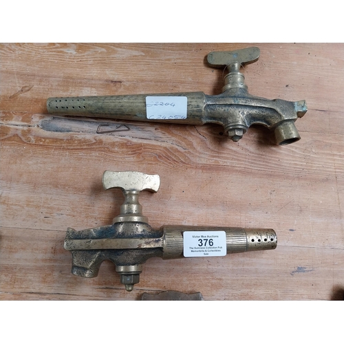 376 - Collection of eight early 20th C. brass barrel taps. {22 cm H x 14 cm W to 14 cm H x 7 cm W}.