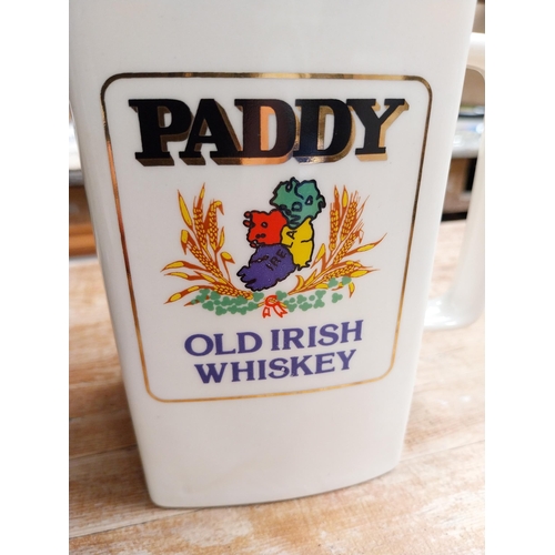 377 - Paddy Old Irish Whiskey Wade ceramic water jug {16 cm H x 14 cm W x 8 cm D} and a smaller one {12 cm... 