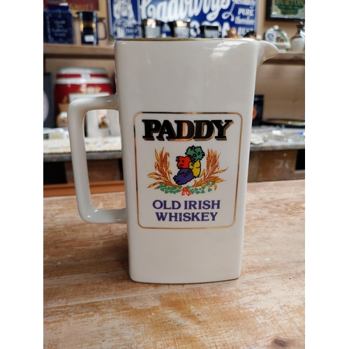 377 - Paddy Old Irish Whiskey Wade ceramic water jug {16 cm H x 14 cm W x 8 cm D} and a smaller one {12 cm... 