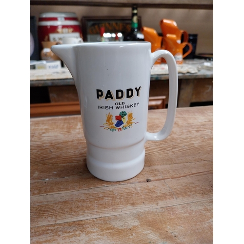 377 - Paddy Old Irish Whiskey Wade ceramic water jug {16 cm H x 14 cm W x 8 cm D} and a smaller one {12 cm... 