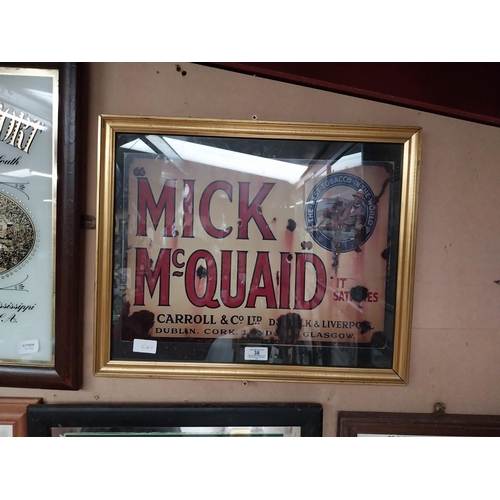 38 - Framed Mick McQuaid advertising print. {42 cm H x 52 cm W}.