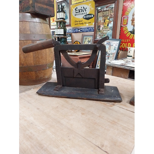 383 - Early 20th C. metal and wood tobacco cutter. {32 cm H x 72 cm W x 10 cm D}.