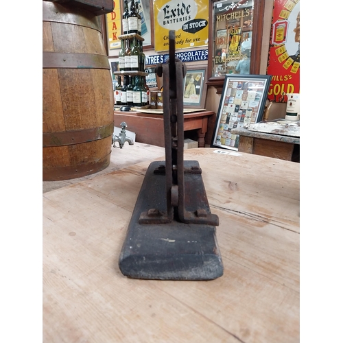 383 - Early 20th C. metal and wood tobacco cutter. {32 cm H x 72 cm W x 10 cm D}.