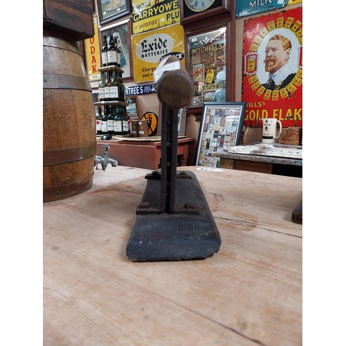 383 - Early 20th C. metal and wood tobacco cutter. {32 cm H x 72 cm W x 10 cm D}.