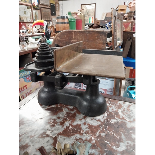 389 - 19th C. brass and metal shop scales with original set of graduated weights. {25 cm H x 34 cm W x 26 ... 