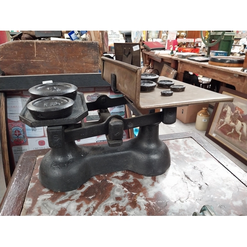 389 - 19th C. brass and metal shop scales with original set of graduated weights. {25 cm H x 34 cm W x 26 ... 