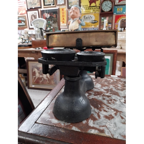 389 - 19th C. brass and metal shop scales with original set of graduated weights. {25 cm H x 34 cm W x 26 ... 