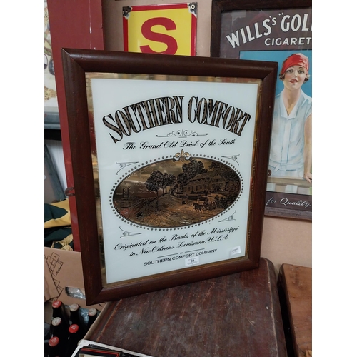 39 - Framed Southern Comfort glass advertisement. {54 cm H x 47 cm W}.