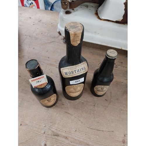 395 - Three cardboard display advertising Guinness bottles. {27 cm H to 19 cm H}. PART OF THE DAVID HUGHES... 