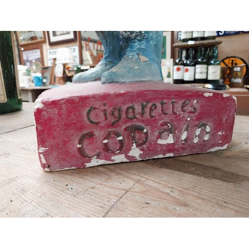 401 - 1920's Copain Cigarettes plaster advertising figure. {81 cm H x 35 cm W x 34 cm D}.