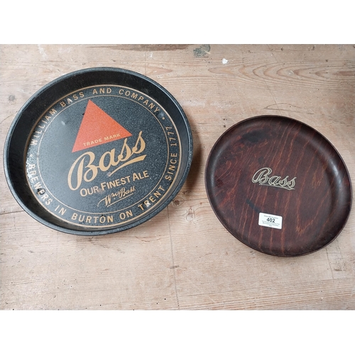 402 - Two Bass drinks trays - one wooden one tinplate. {25 cm Dia. and 21 cm Dia.}