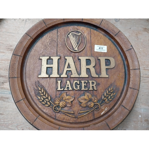 411 - 1970's Harp Lager advertising barrel end. {7 cm H x 38 cm Dia.}