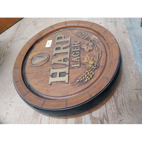 411 - 1970's Harp Lager advertising barrel end. {7 cm H x 38 cm Dia.}