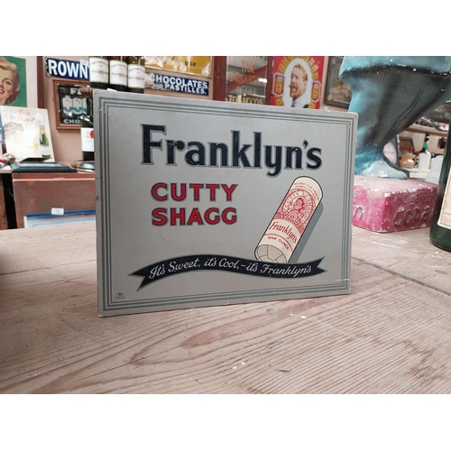 413 - Franklyn's Cutty Shagg Tobacco showcard. {19 cm H x 26 cm W}.