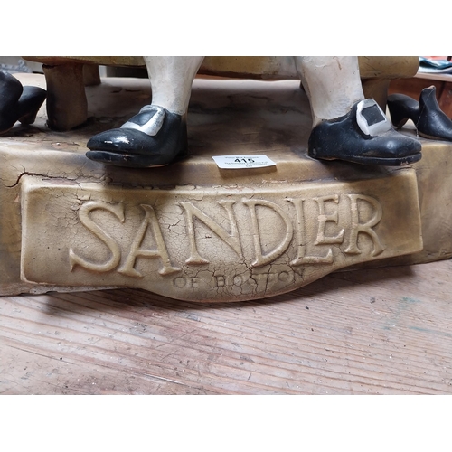 415 - Sandler of Boston Ruberoid Cobbler advertising figure. {46 cm H x 33 cm W x 20 cm D}