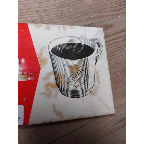 419 - Drink Hot Bovril Here and Now celluloid advertising sign. {12 cm H x 25 cm W}.