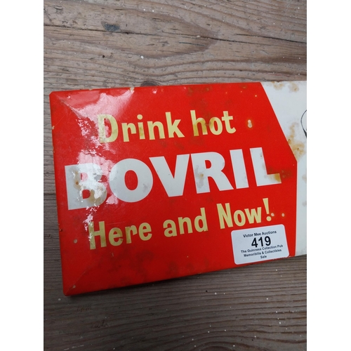 419 - Drink Hot Bovril Here and Now celluloid advertising sign. {12 cm H x 25 cm W}.