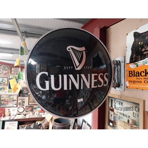 42 - Guinness Perspex double sided light up advertising sign with bracket. {64 cm Dia.}