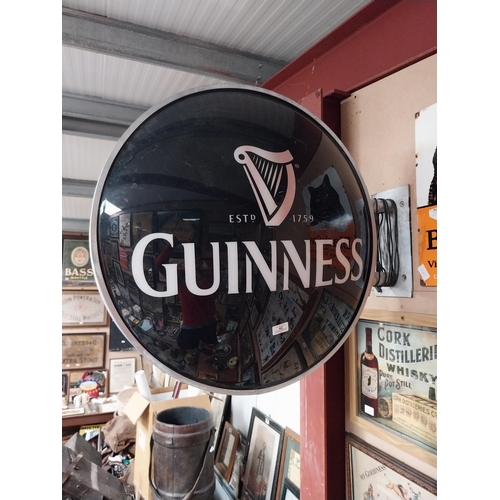 42 - Guinness Perspex double sided light up advertising sign with bracket. {64 cm Dia.}