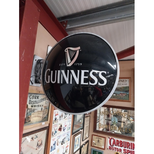 42 - Guinness Perspex double sided light up advertising sign with bracket. {64 cm Dia.}