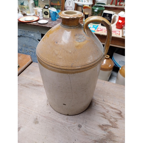 424 - 19th C. Stoneware whiskey flagon in original basket {45cm H x 30 cm Dia.} and another without basket... 