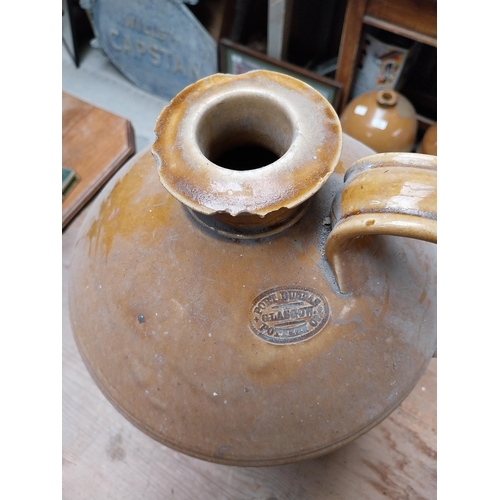 424 - 19th C. Stoneware whiskey flagon in original basket {45cm H x 30 cm Dia.} and another without basket... 