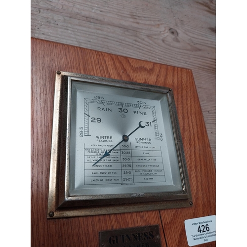 426 - Guinness barometer. {22 cm h x 22 cm W}.