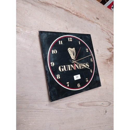 427 - 1970's Perspex Guinness battery advertising clock. {30 cm H x 30 cm W}.