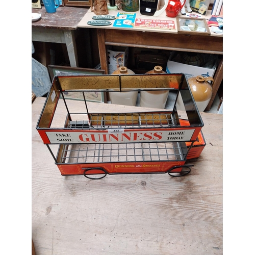 432 - Guinness advertising tinplate bottle crate in the form of a Bus. {27 cm H x 47 cm W x 23 cm D}.