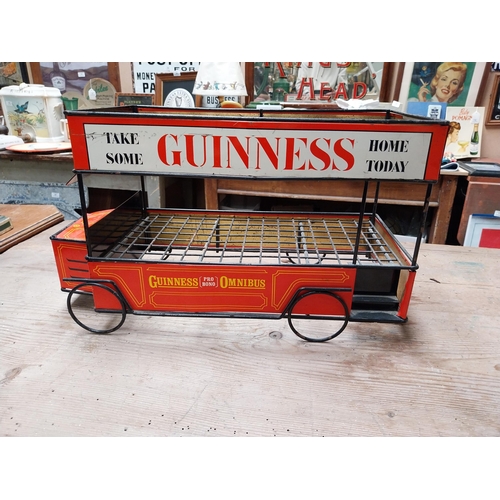 432 - Guinness advertising tinplate bottle crate in the form of a Bus. {27 cm H x 47 cm W x 23 cm D}.