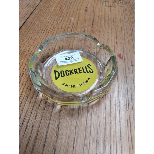 438 - Dockrells of Georges Street Dublin glass ashtray. {3 cm H x 11 cm Dia.}.