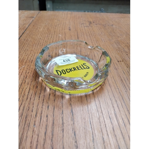 438 - Dockrells of Georges Street Dublin glass ashtray. {3 cm H x 11 cm Dia.}.