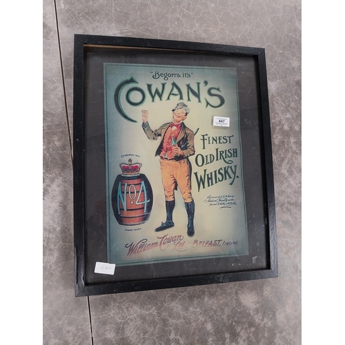 447 - Cowans Finest Old Irish Whiskey framed advertising print. {53 cm H x 43 cm W}.