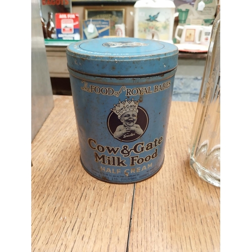 449 - Two Cow and Gate advertising tins, two Biscuit tins, Tea tin and Soda Siphon. {29 cm H and 6 cm H}.