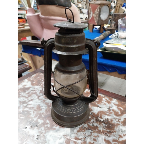 457 - Brass and metal Tilly lamp and two Hurricane lamps. {33 cm H x 16 cm Dia. and 25 cm H x 14 cm Dia.}.