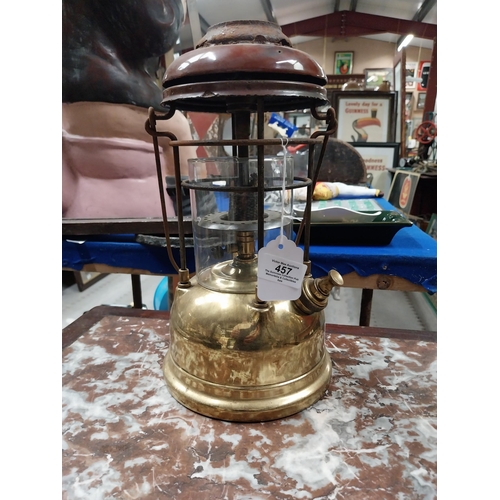 457 - Brass and metal Tilly lamp and two Hurricane lamps. {33 cm H x 16 cm Dia. and 25 cm H x 14 cm Dia.}.