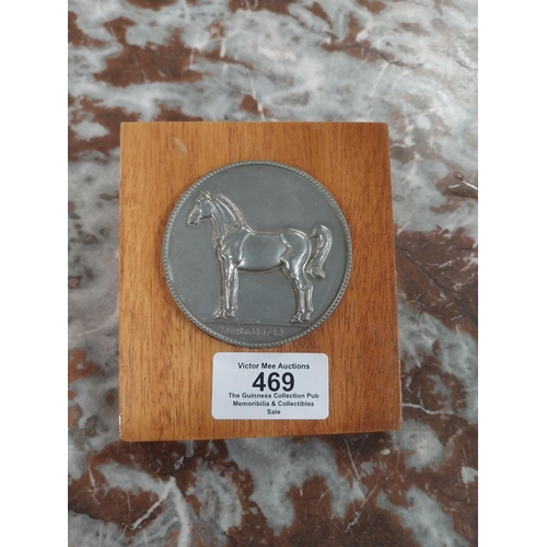 469 - Coin specially struck in Great Britain for White Horse Distillers Ltd mounted on wooden presentation... 