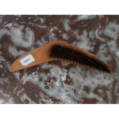 473 - Harp Boomerang Clothes Brush. {4 cm H x 27 cm W}.