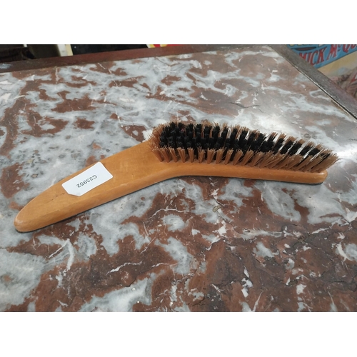 473 - Harp Boomerang Clothes Brush. {4 cm H x 27 cm W}.