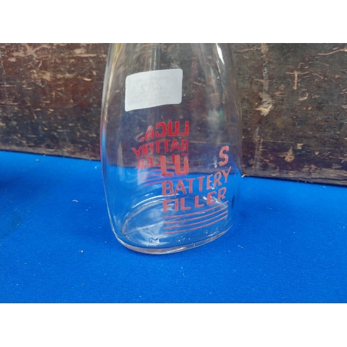 482 - Glass Lucas Battery filler advertising bottle. {18 cm H x 8 cm W} .