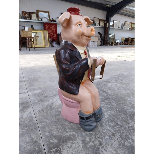 489 - Plastic model of seated Pig. {73 cm H x 32 cm W x 34 cm D}.