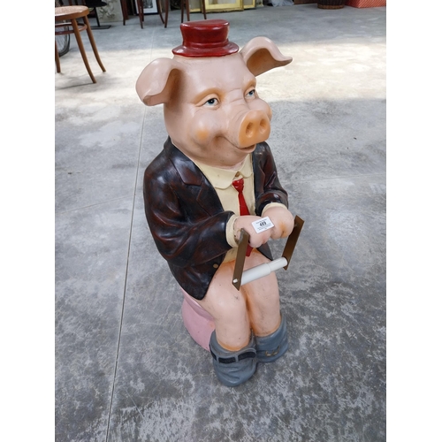 489 - Plastic model of seated Pig. {73 cm H x 32 cm W x 34 cm D}.