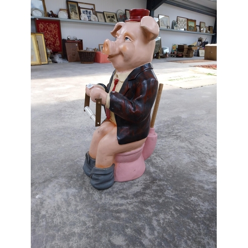 489 - Plastic model of seated Pig. {73 cm H x 32 cm W x 34 cm D}.