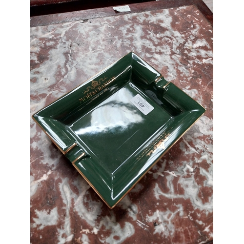 491 - Moet and Chandon {4 cm H x 20 cm W x 16 cm D} ceramic ashtray and John Smith's ceramic ashtray {3 cm... 